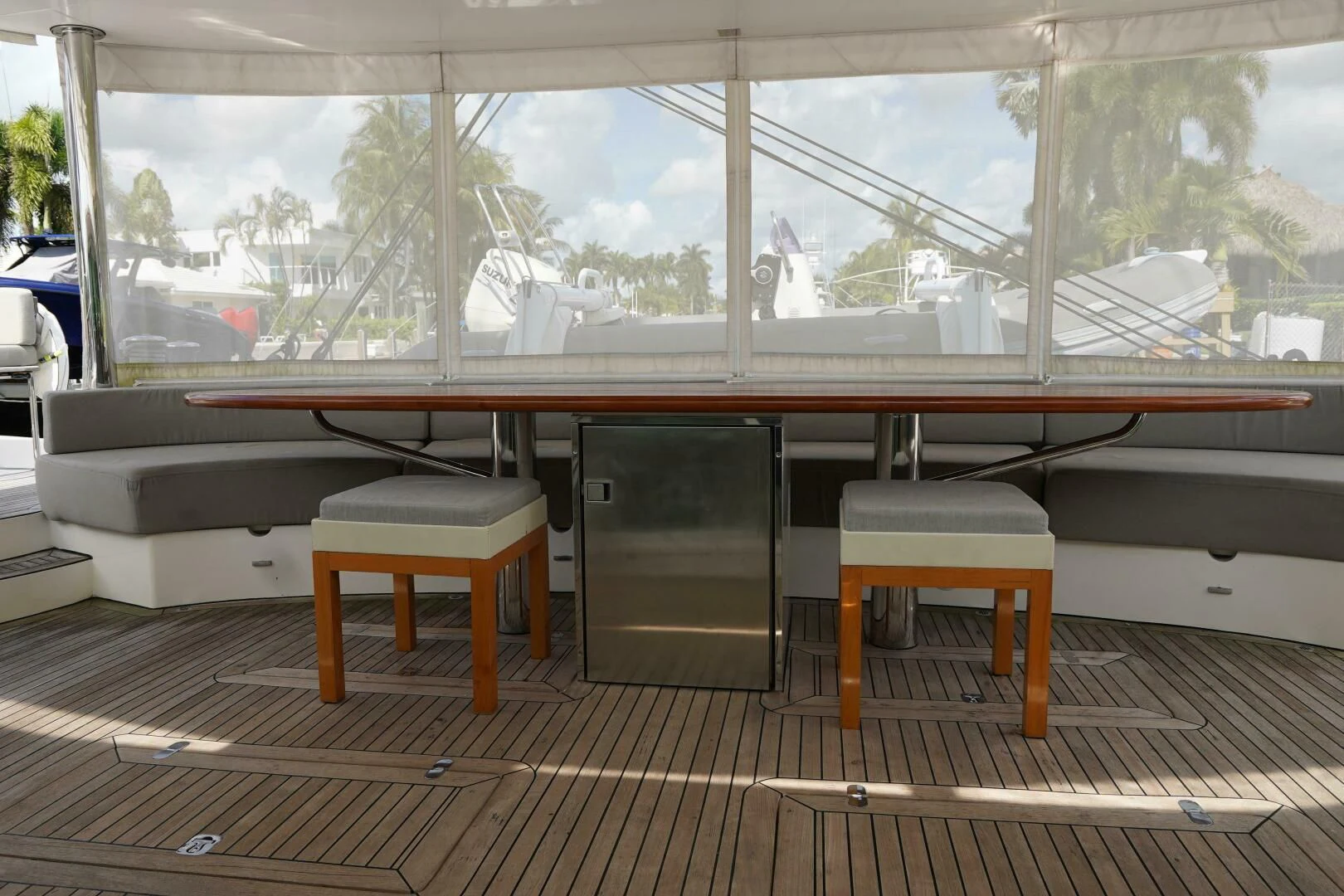 a room with a bench and a table and chairs aboard LAYSAN Yacht for Sale