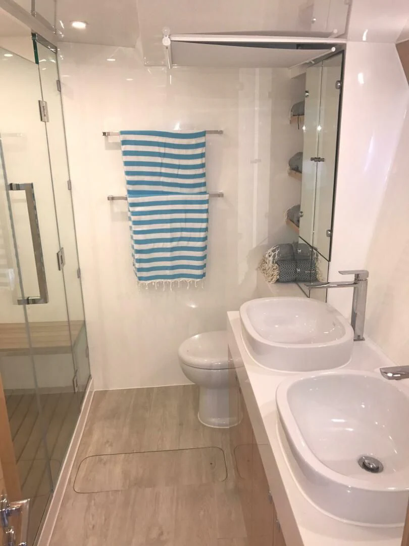 a bathroom with a sink and toilet aboard LAYSAN Yacht for Sale