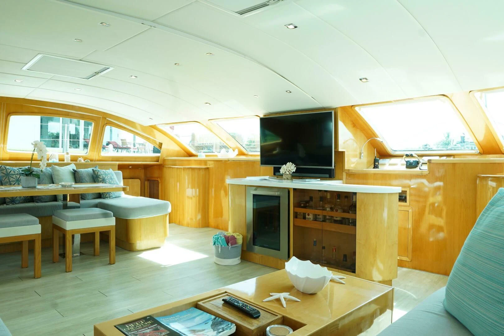 a room with a tv and a fireplace aboard LAYSAN Yacht for Sale