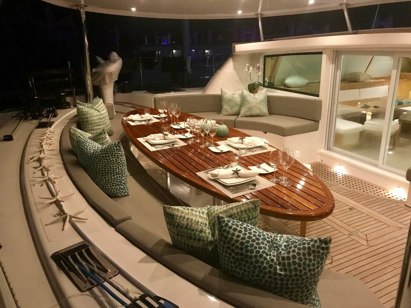 a table with plates and glasses on it aboard LAYSAN Yacht for Sale