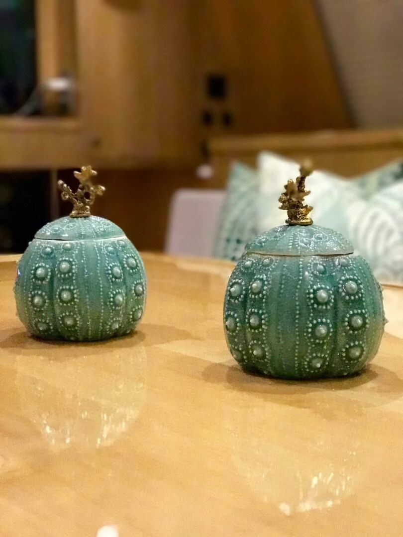 a couple of glass vases on a table aboard LAYSAN Yacht for Sale