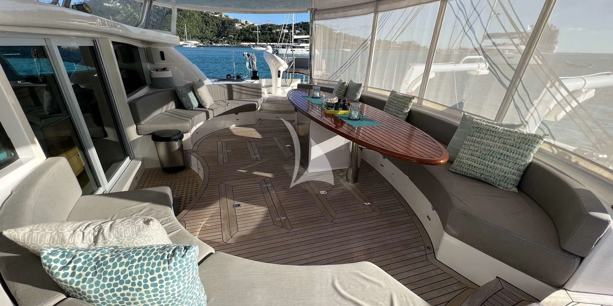 a living room with a table and chairs aboard LAYSAN Yacht for Sale