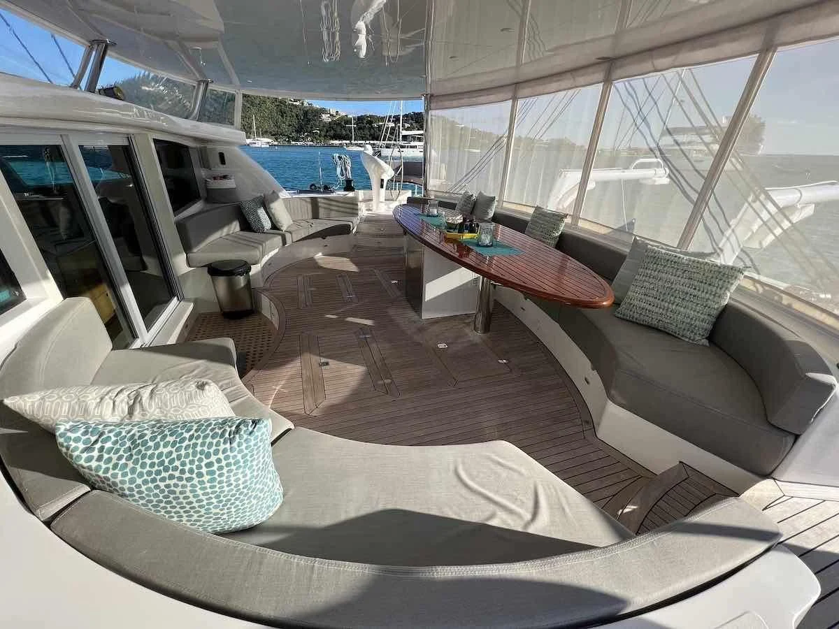 a room with a couch and a table and chairs aboard LAYSAN Yacht for Sale