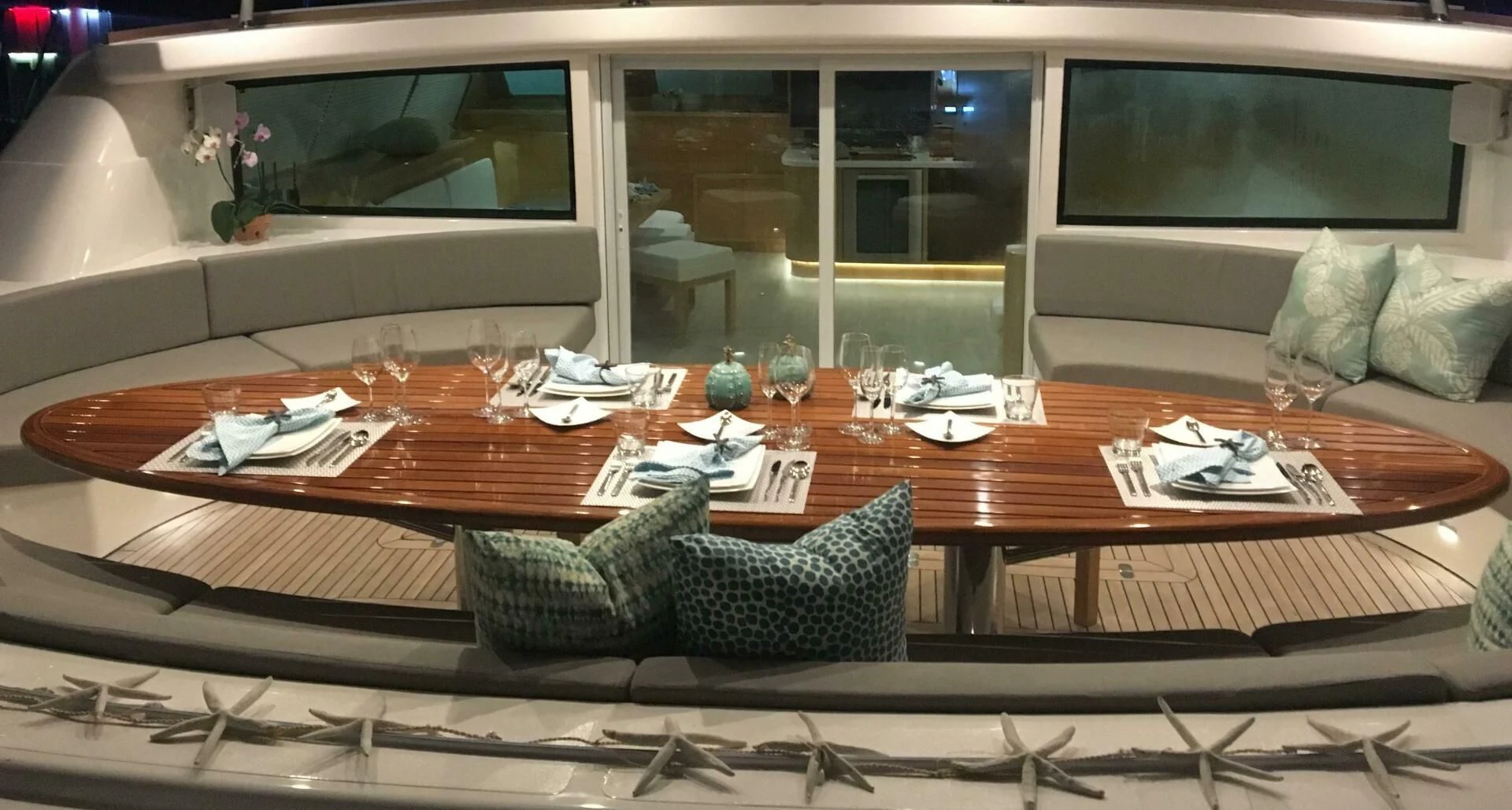 a table with a couch and chairs aboard LAYSAN Yacht for Sale