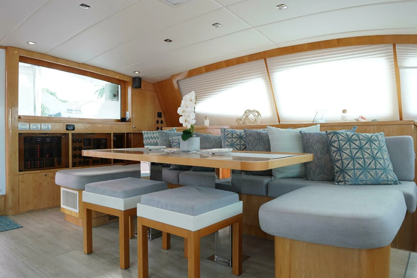 a living room with a couch and a table aboard LAYSAN Yacht for Sale