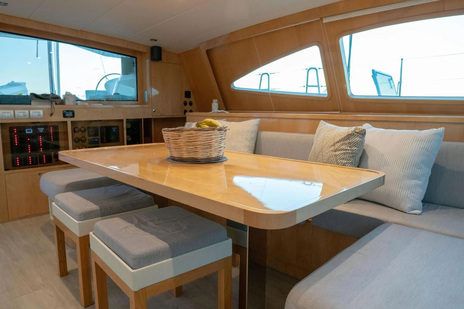 a kitchen with a table and couch aboard LAYSAN Yacht for Sale