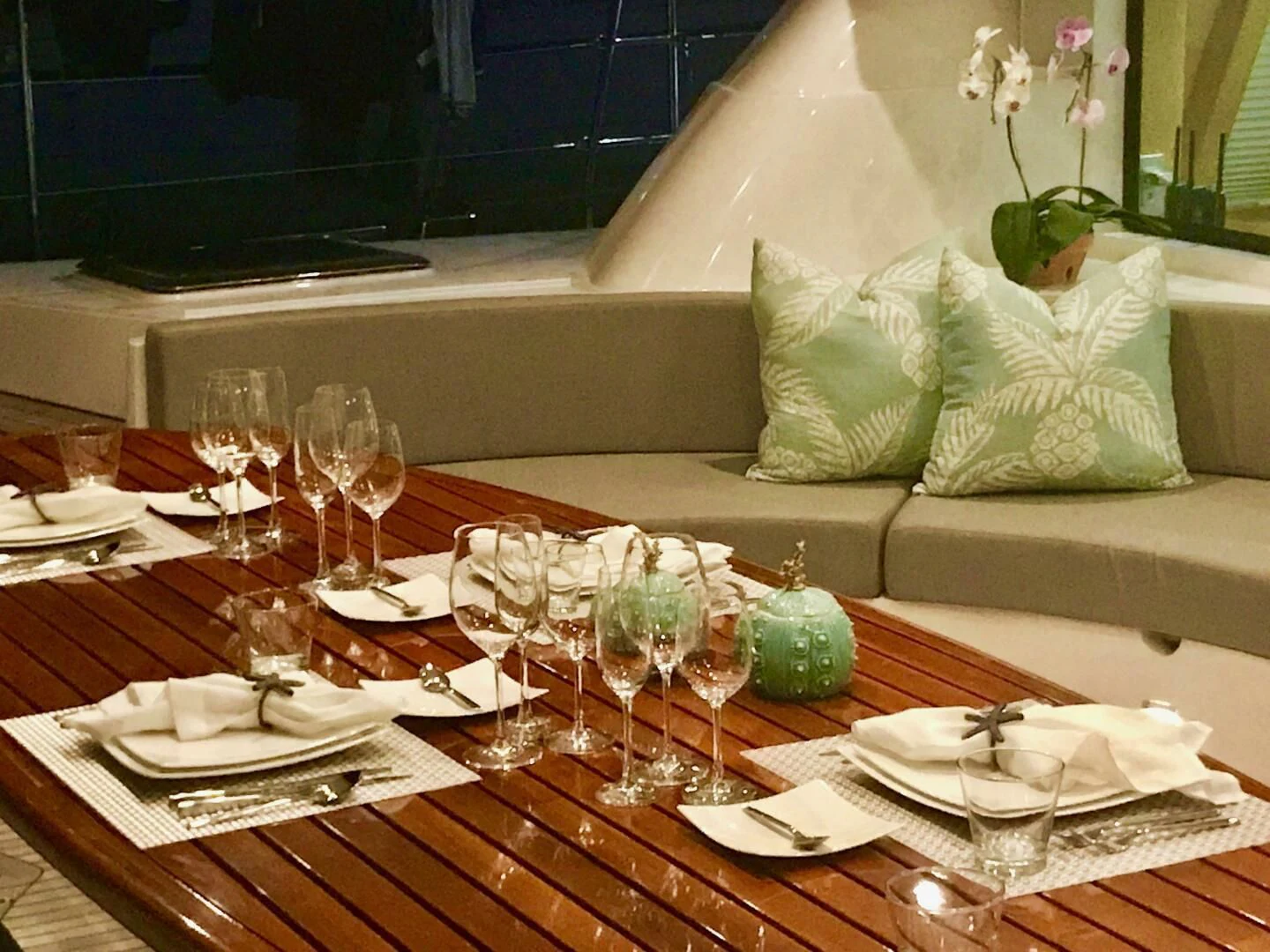 a table with plates and glasses on it aboard LAYSAN Yacht for Sale