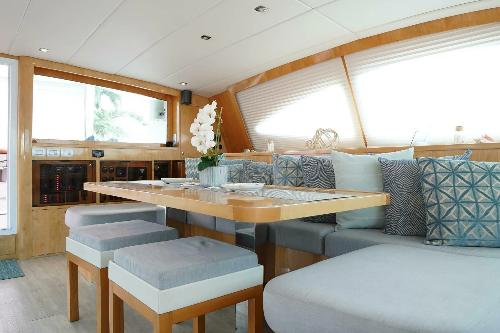 a living room with a couch and a table aboard LAYSAN Yacht for Sale