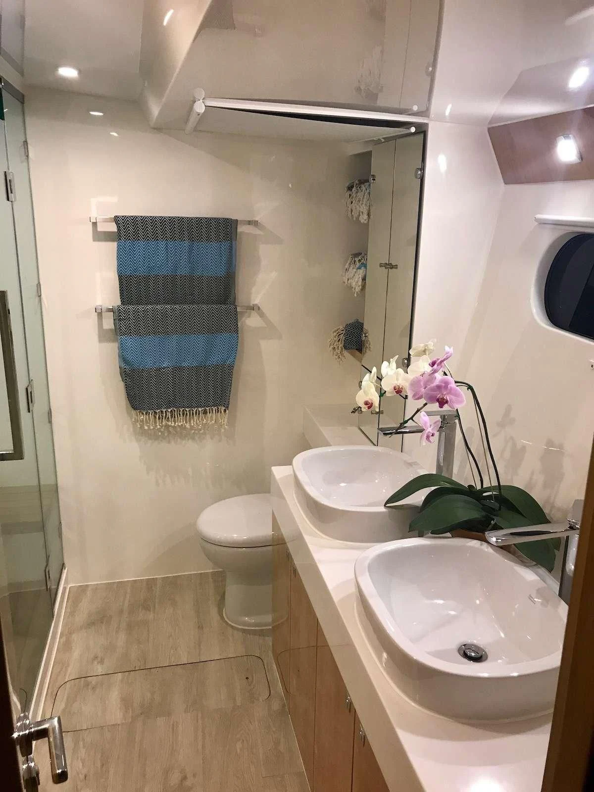 a bathroom with a sink and a toilet aboard LAYSAN Yacht for Sale