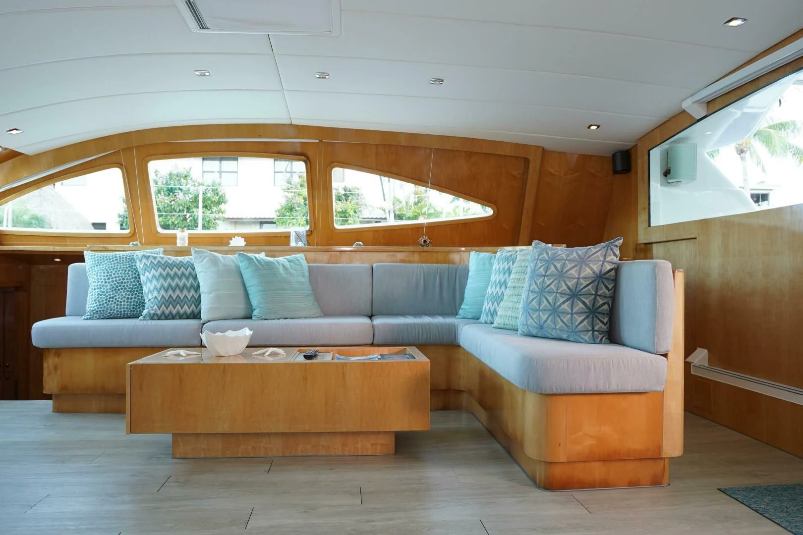 a living room with a couch and a table aboard LAYSAN Yacht for Sale