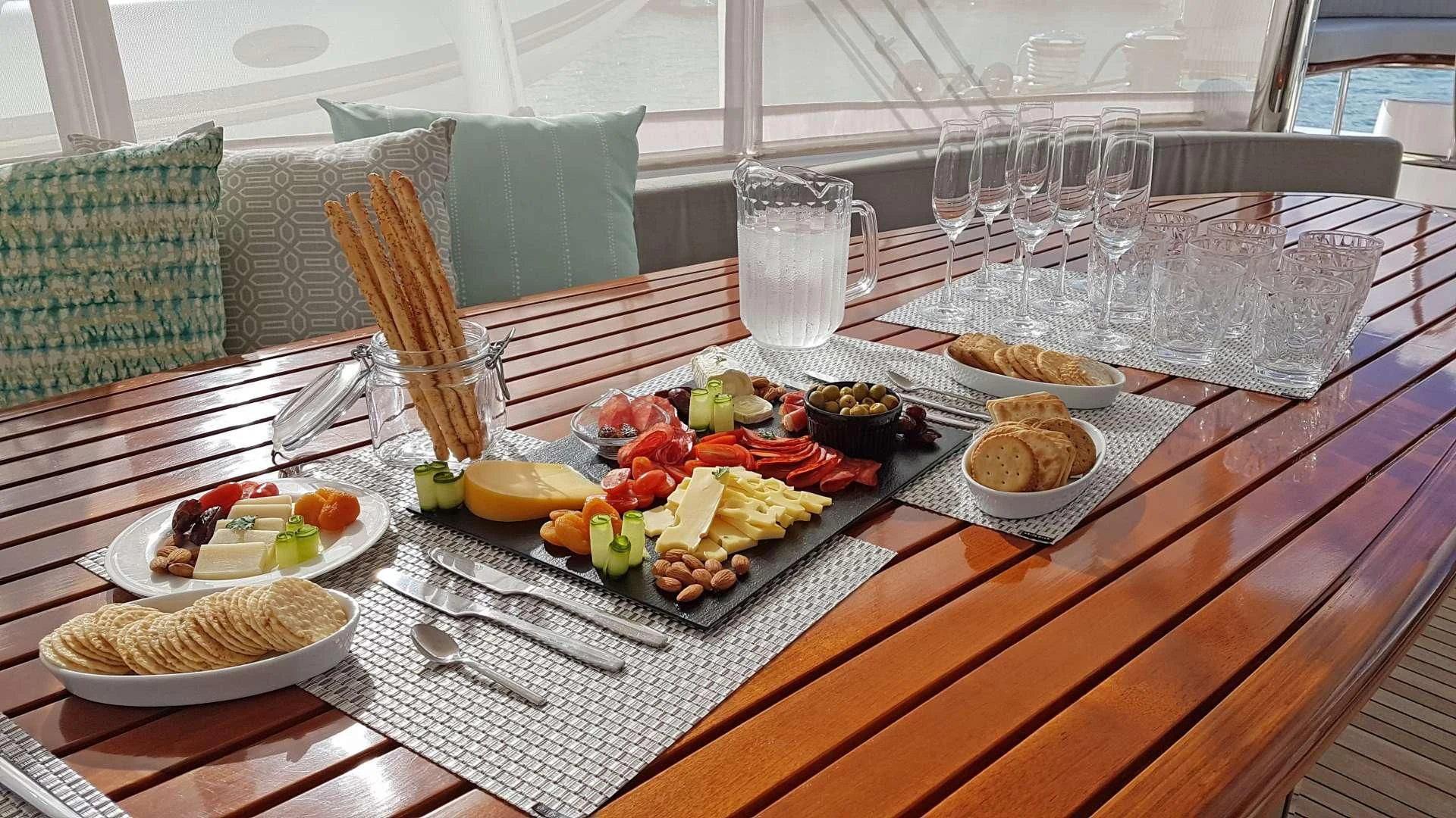 a table with food and plates aboard LAYSAN Yacht for Sale