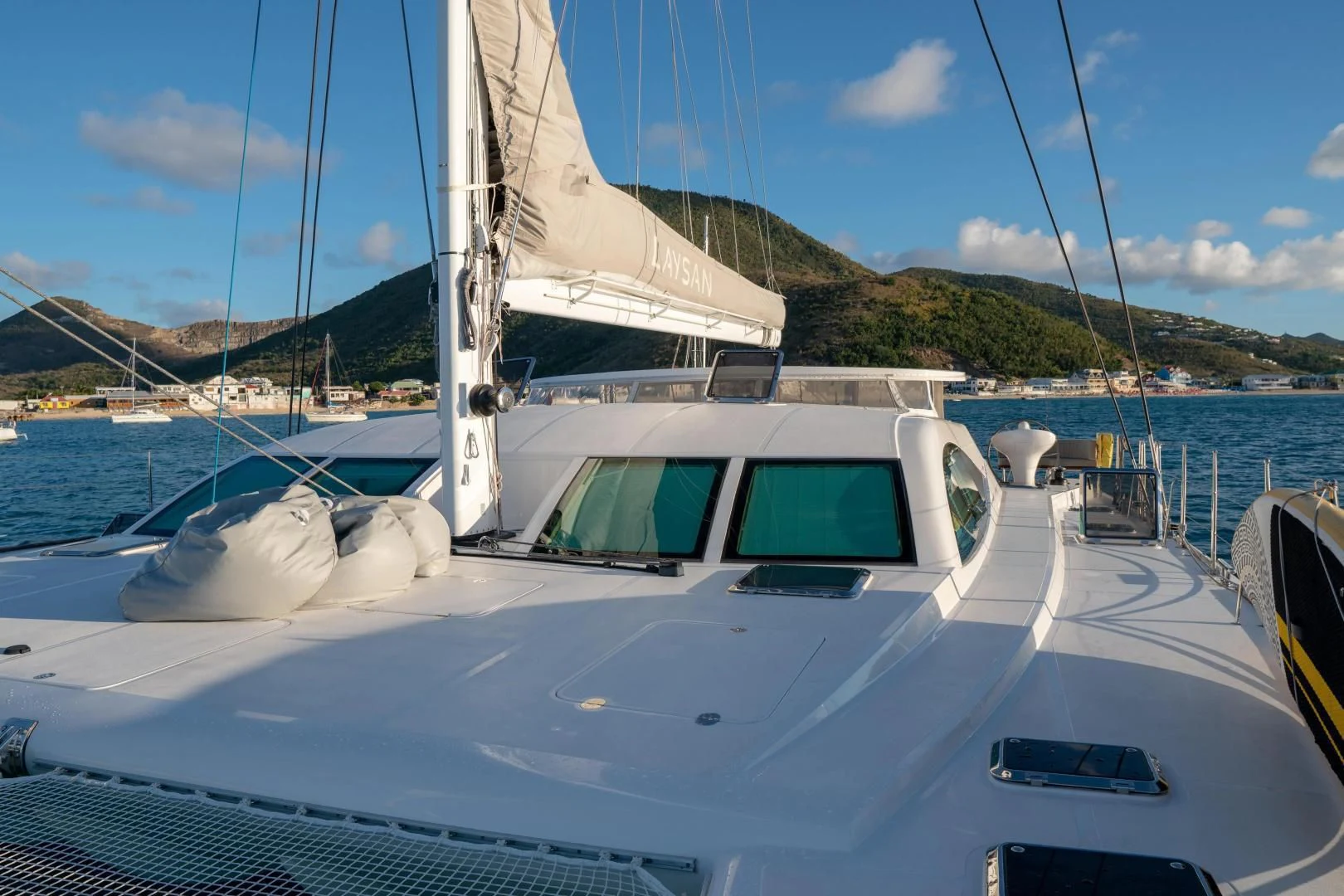 a white boat in the water aboard LAYSAN Yacht for Sale