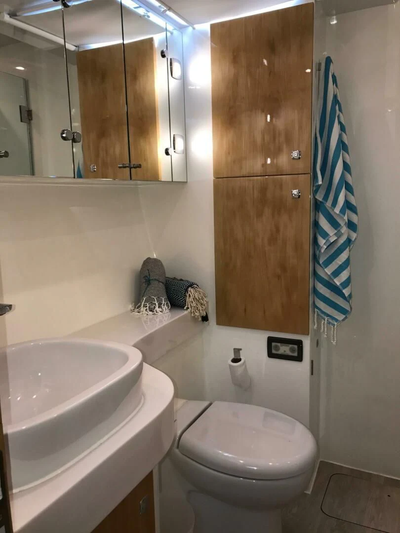a bathroom with a sink and a toilet aboard LAYSAN Yacht for Sale