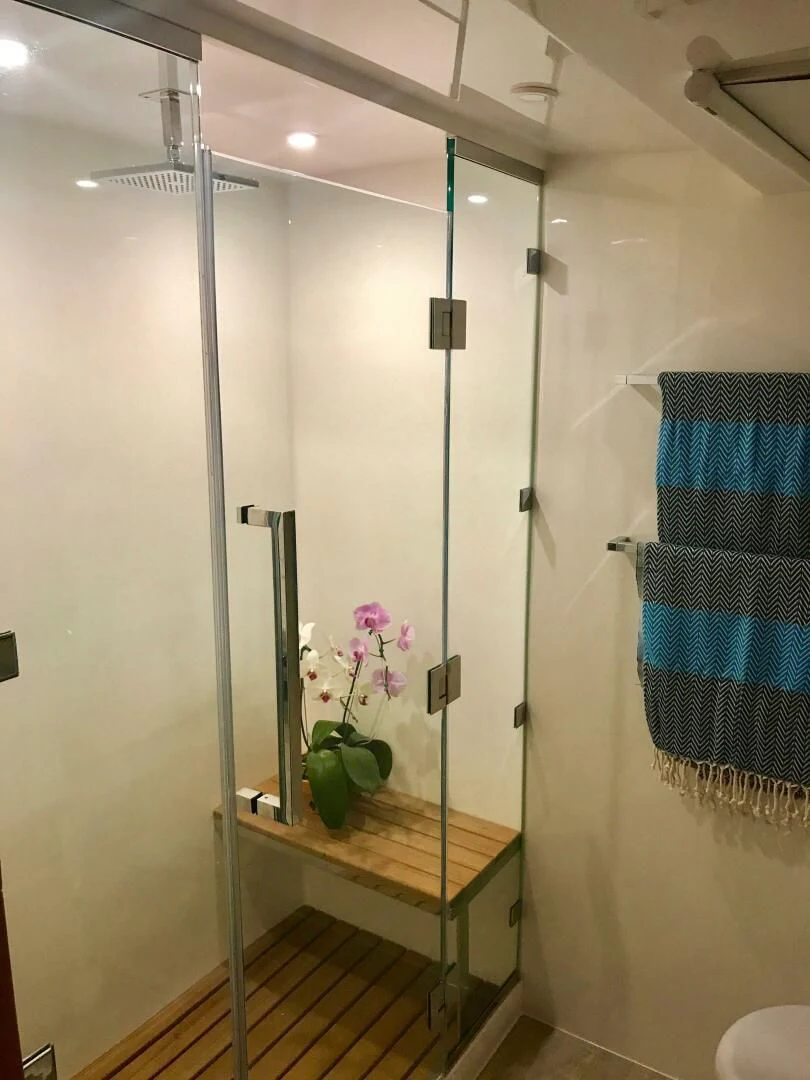 a shower with a glass door aboard LAYSAN Yacht for Sale
