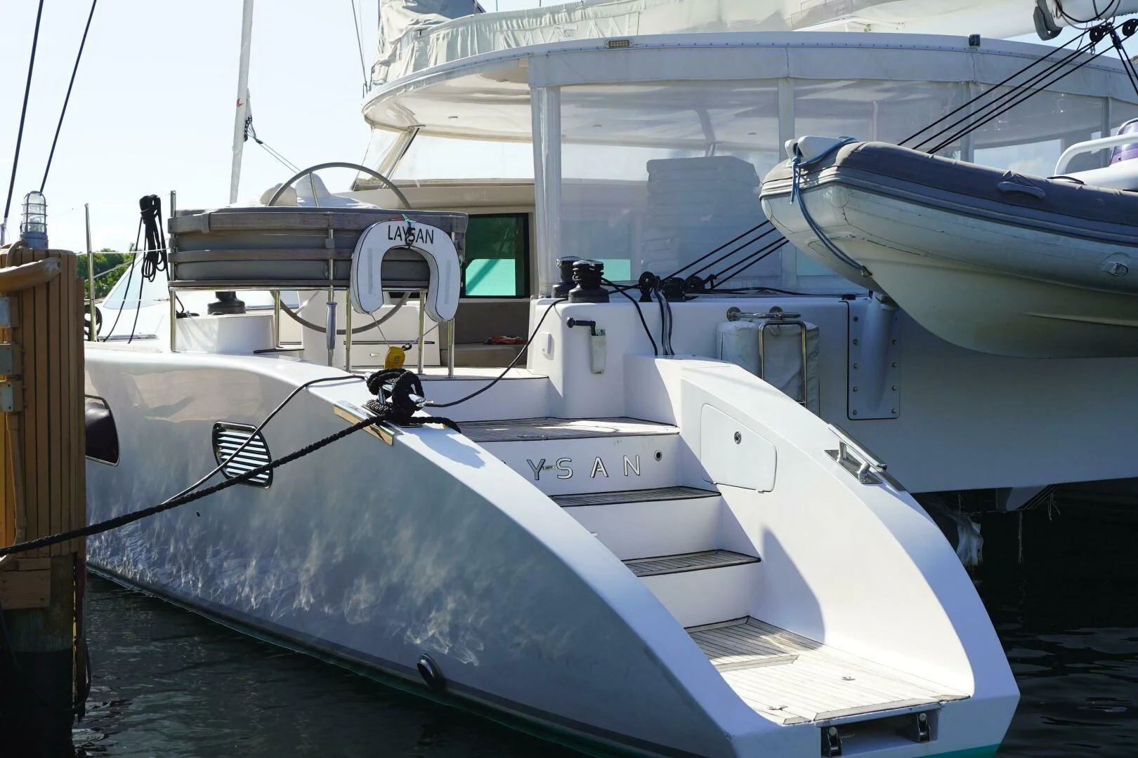 a boat docked at a pier aboard LAYSAN Yacht for Sale