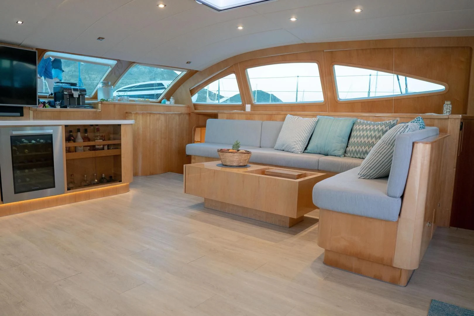 a living room with a couch and a tv aboard LAYSAN Yacht for Sale