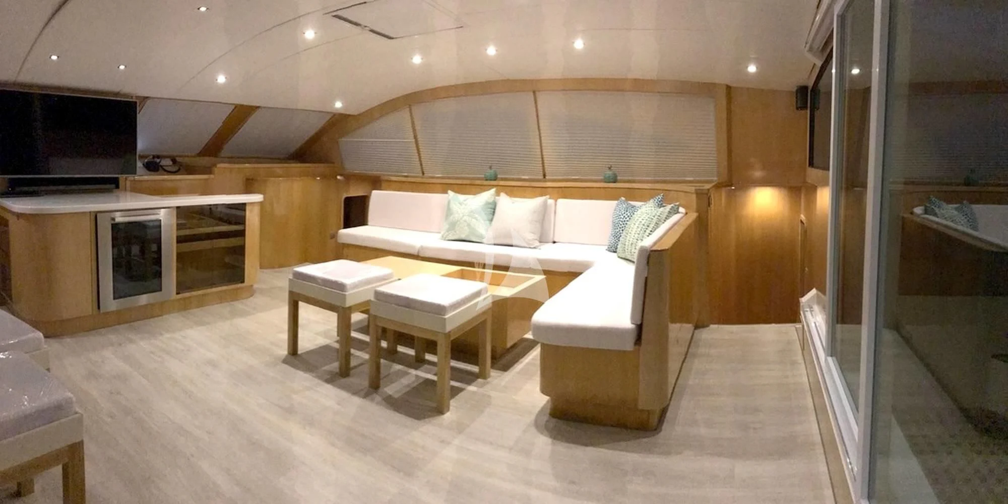 a room with a bed and a table aboard LAYSAN Yacht for Sale