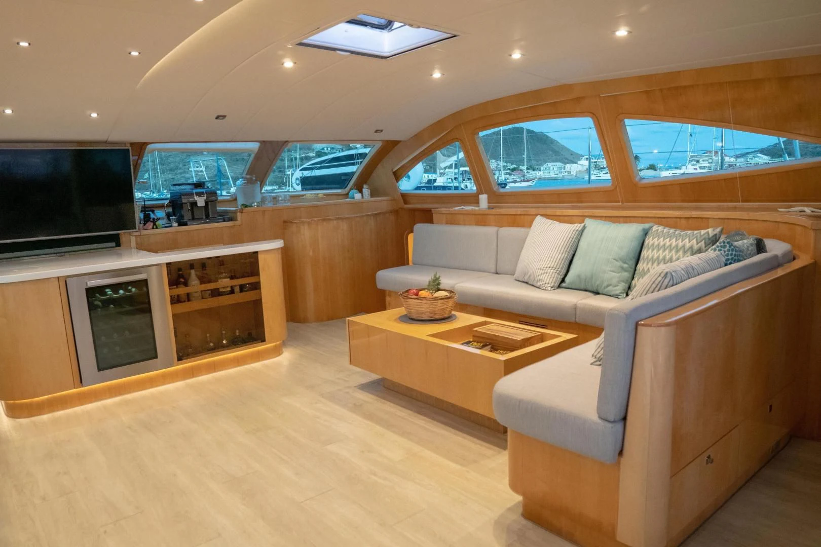 a living room with a couch and a tv aboard LAYSAN Yacht for Sale