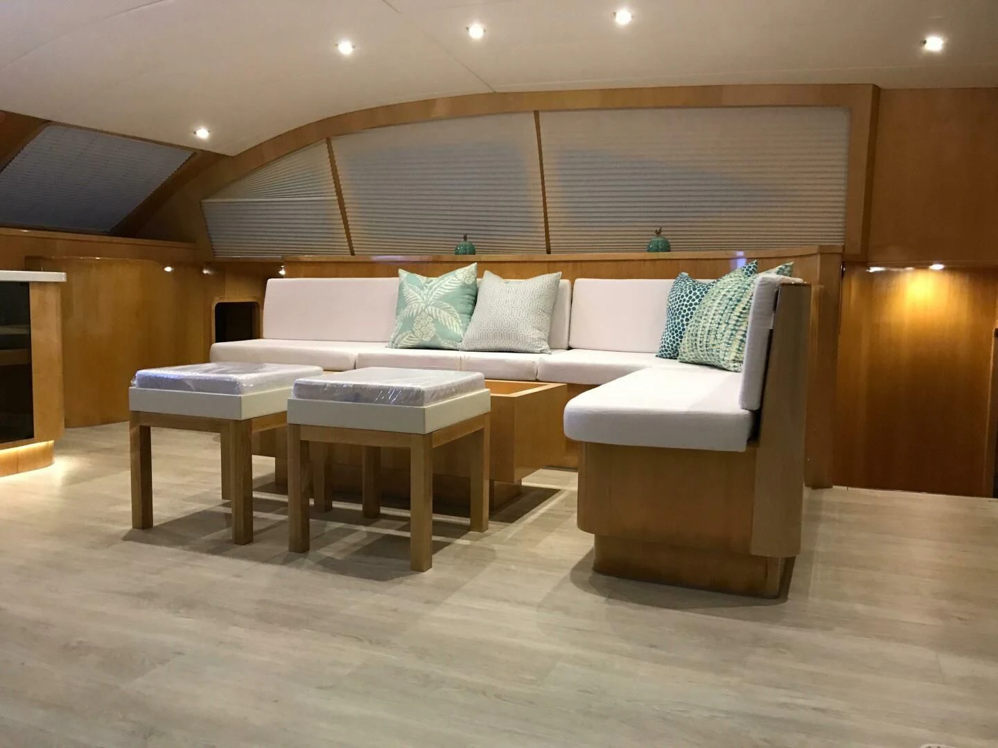 a living room with a couch and a table aboard LAYSAN Yacht for Sale