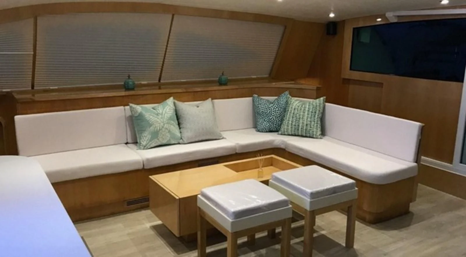 a couch with a table and chairs aboard LAYSAN Yacht for Sale