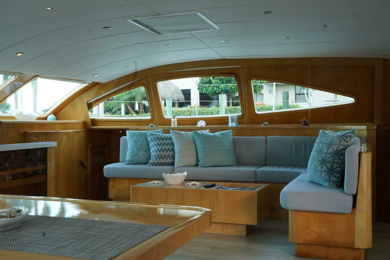 a living room with a couch and a table aboard LAYSAN Yacht for Sale