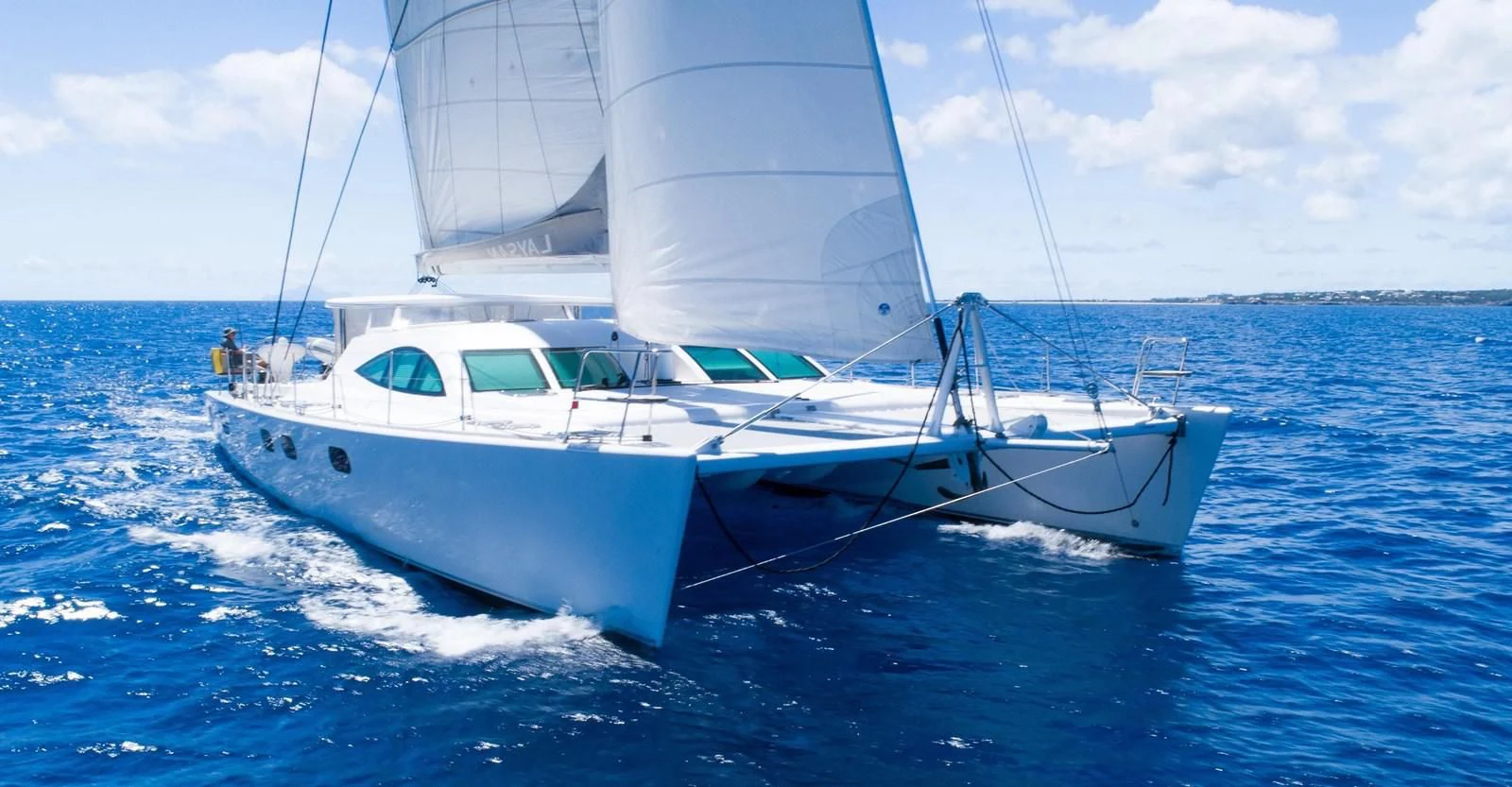 a white boat on the water aboard LAYSAN Yacht for Sale