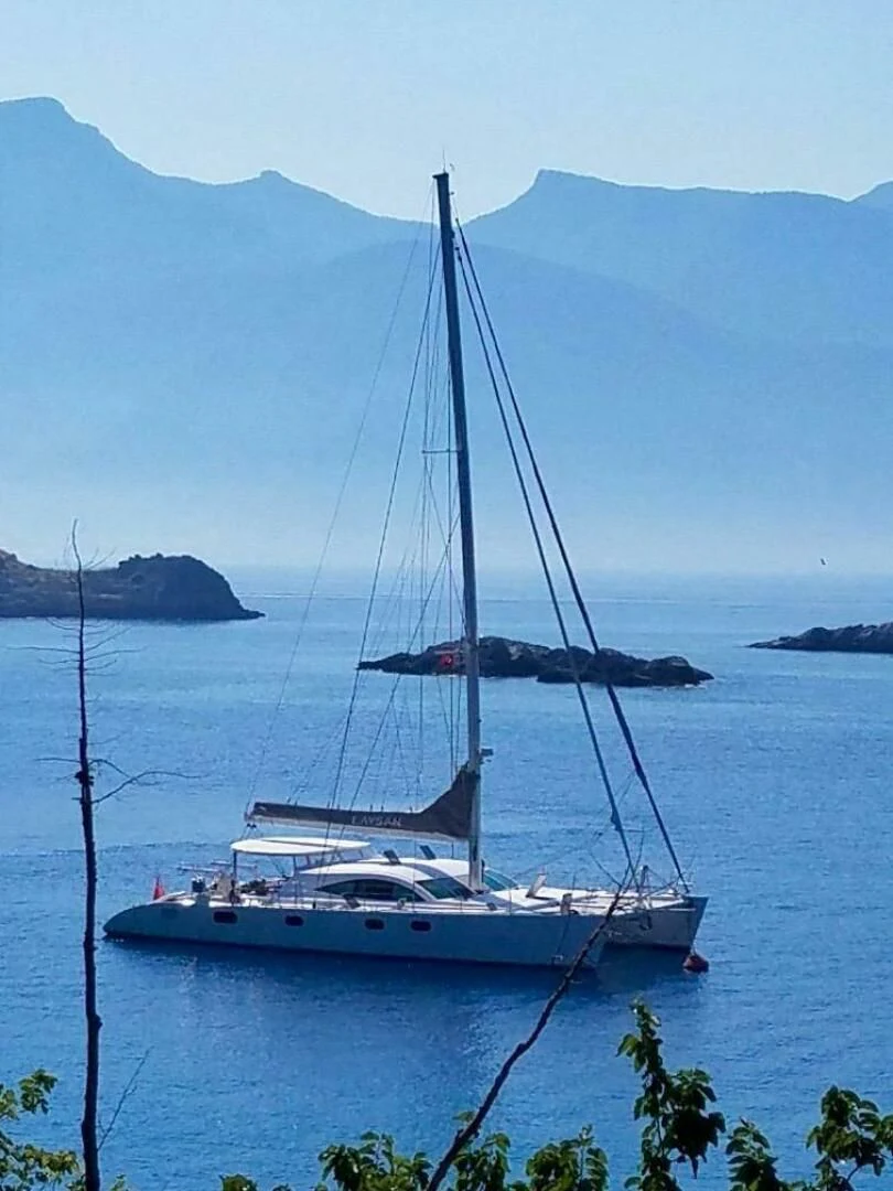 a sailboat on the water aboard LAYSAN Yacht for Sale