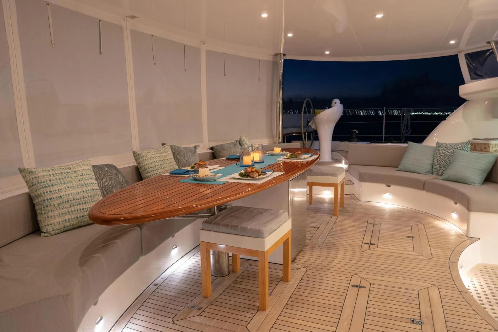 a living room with a table and couches aboard LAYSAN Yacht for Sale