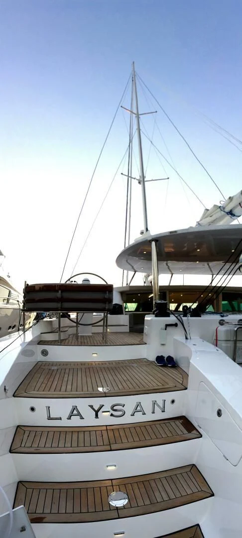 a boat with a large sail aboard LAYSAN Yacht for Sale