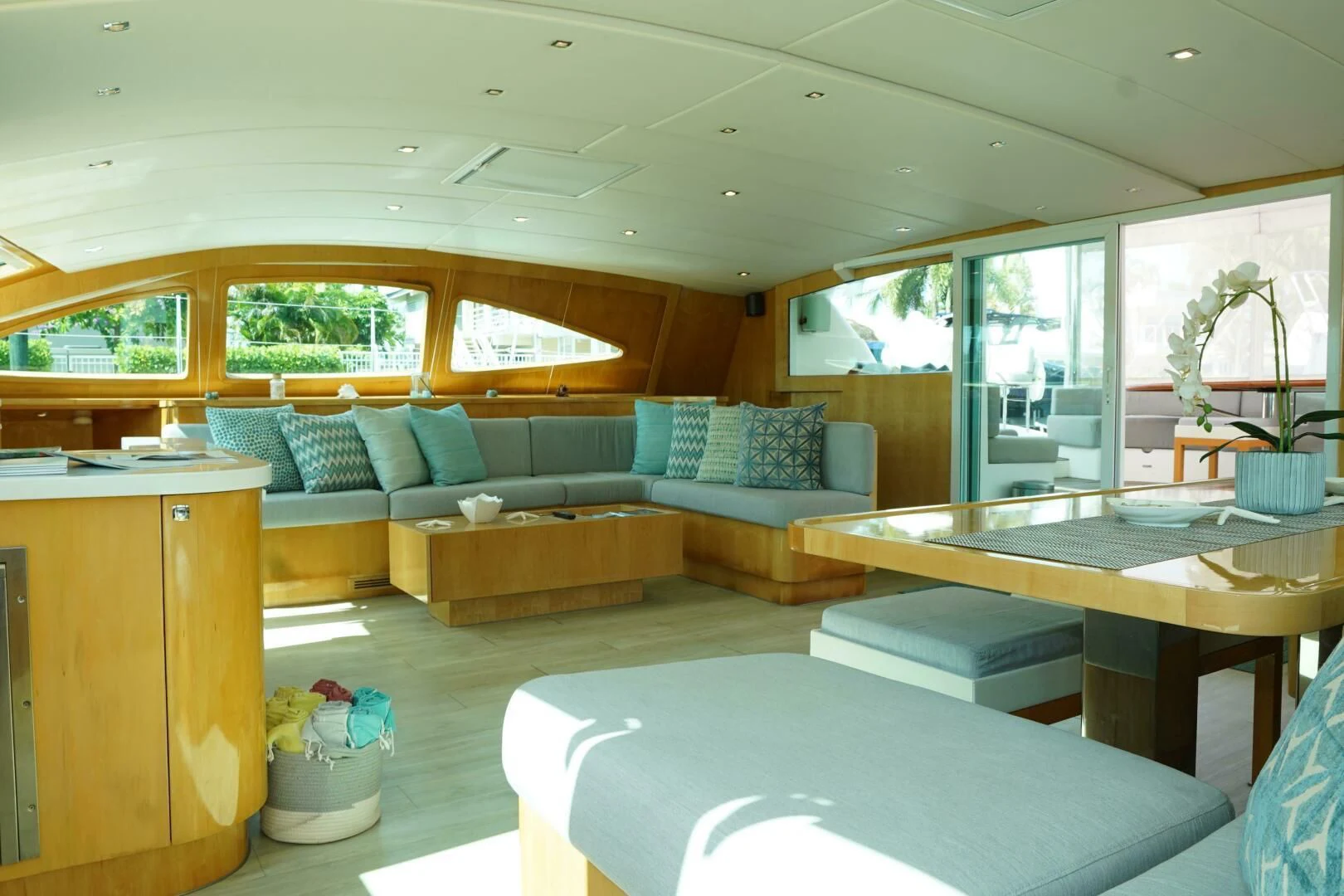 a living room with a couch and a table aboard LAYSAN Yacht for Sale