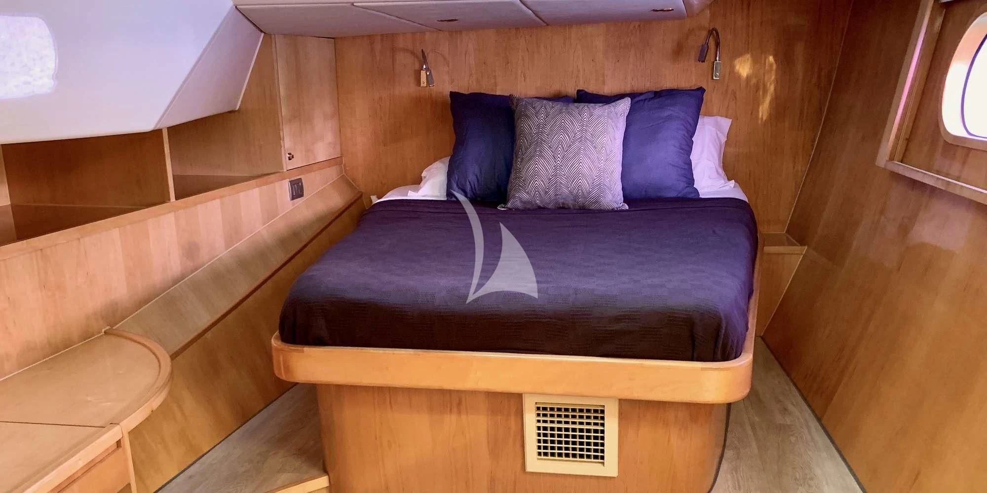 a bed in a room aboard LAYSAN Yacht for Sale
