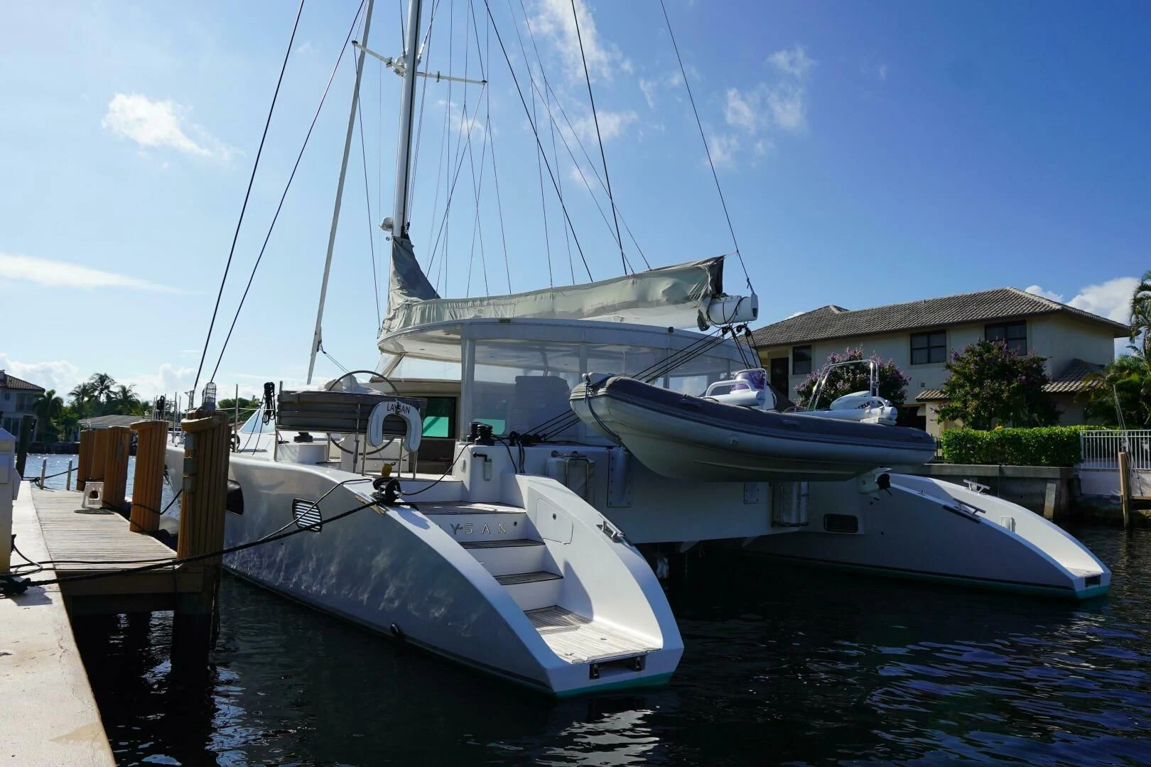 a couple of boats are parked in a harbor aboard LAYSAN Yacht for Sale