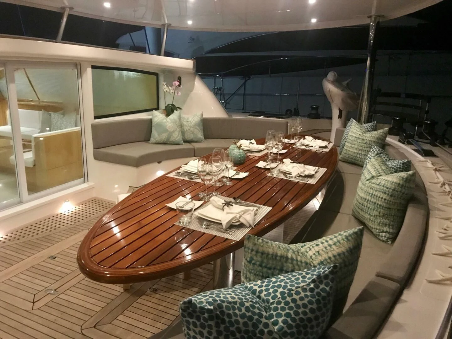 a table with chairs and a couch aboard LAYSAN Yacht for Sale