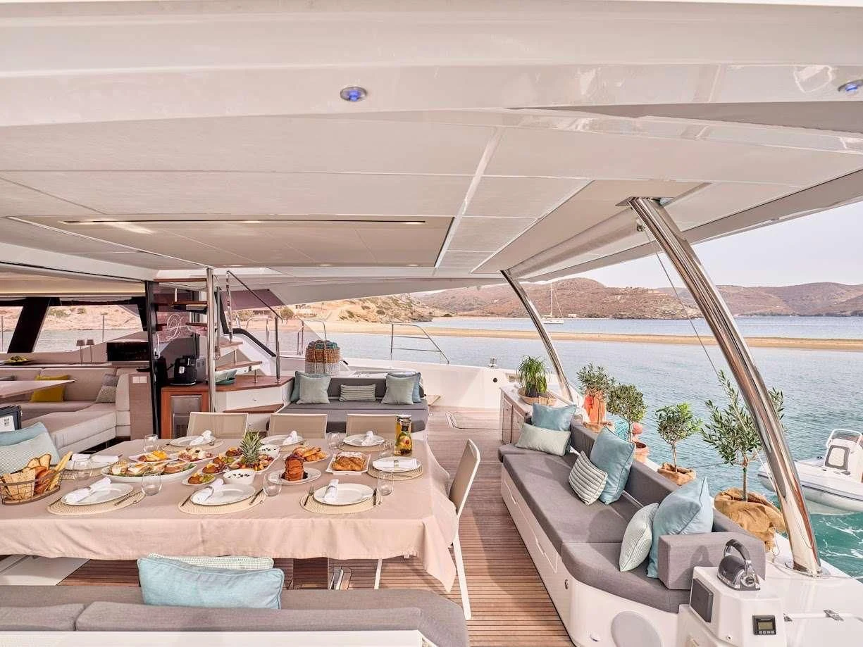 a room with a table and chairs aboard DOLLY Yacht for Charter