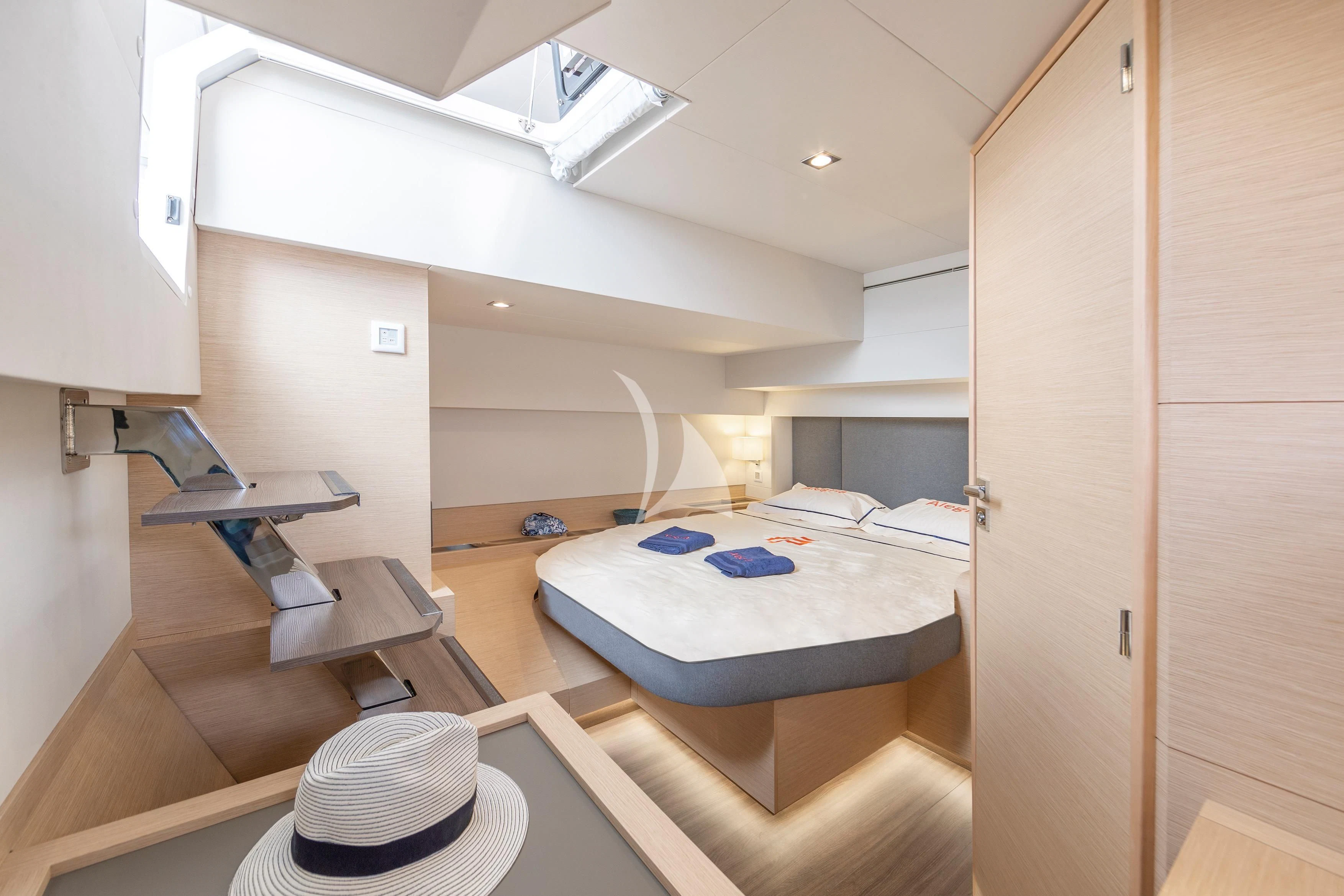 a room with a bed and a hat aboard DOLLY Yacht for Charter