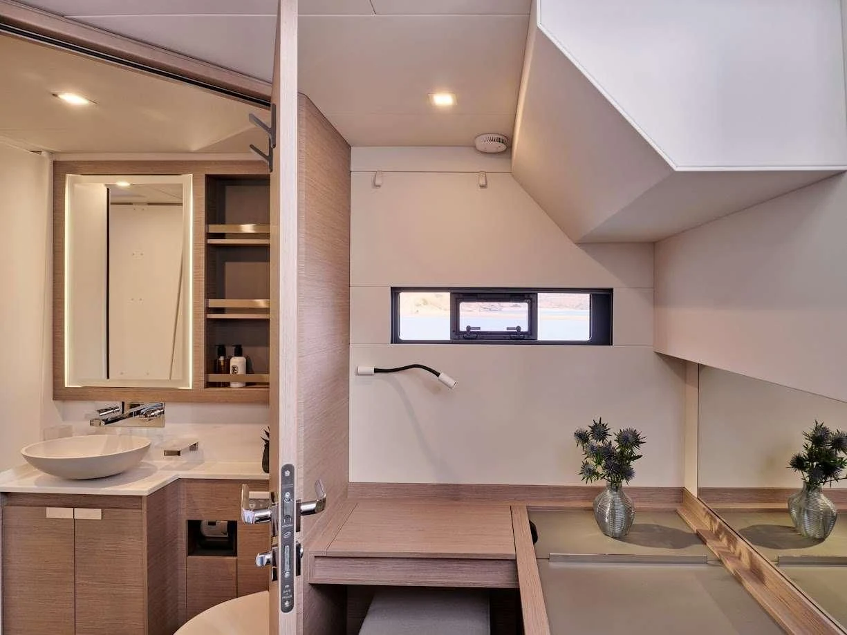 a bathroom with a large mirror aboard DOLLY Yacht for Charter