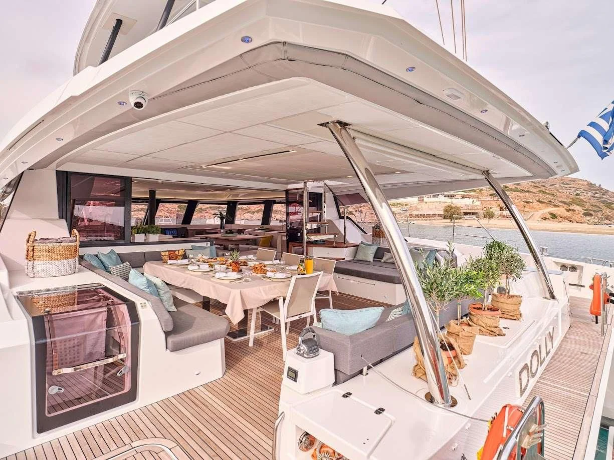 a large patio with a table and chairs aboard DOLLY Yacht for Charter