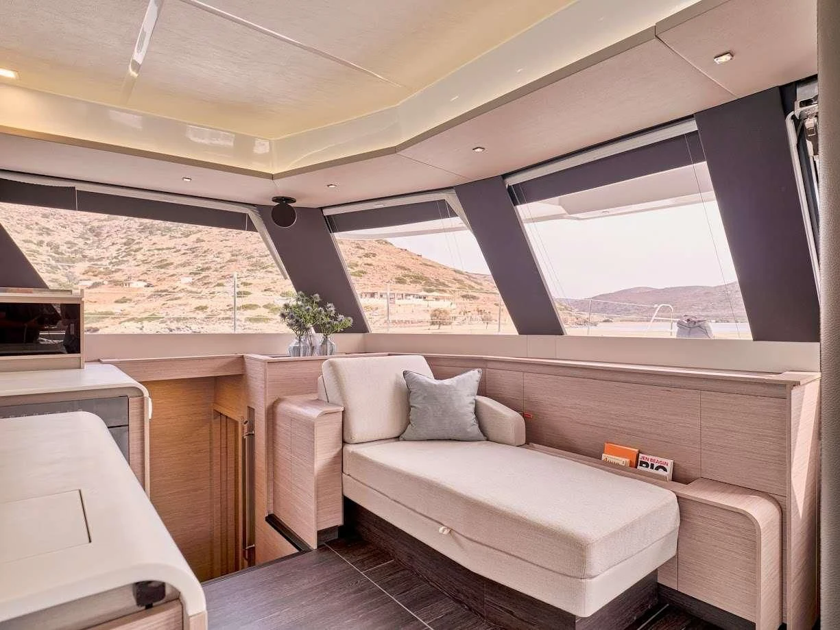 a room with a couch and a table aboard DOLLY Yacht for Charter