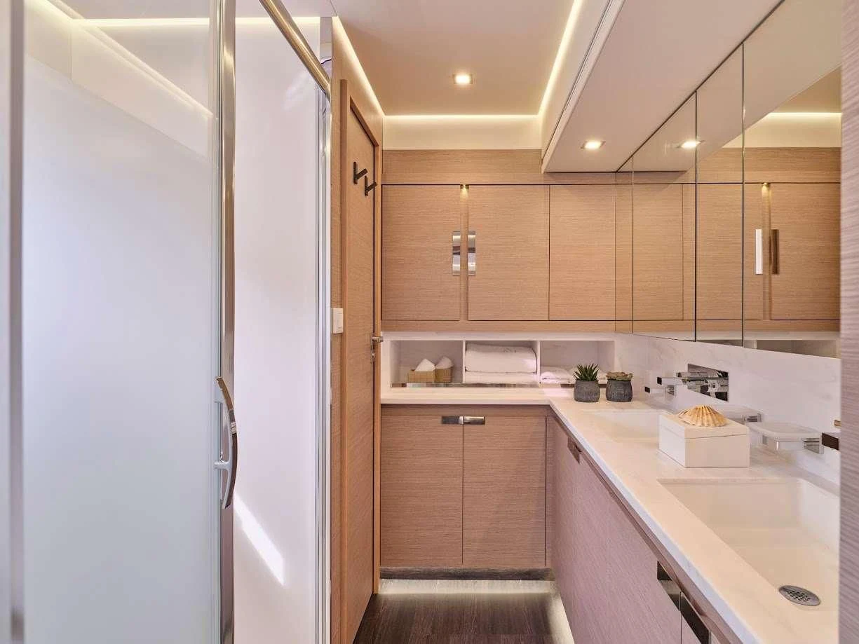 a kitchen with white cabinets aboard DOLLY Yacht for Charter