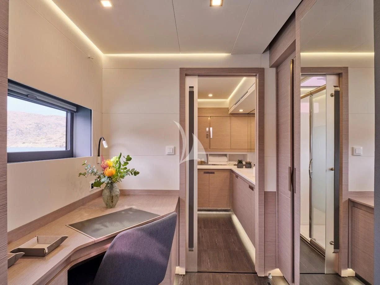 a kitchen with a table and chairs aboard DOLLY Yacht for Charter