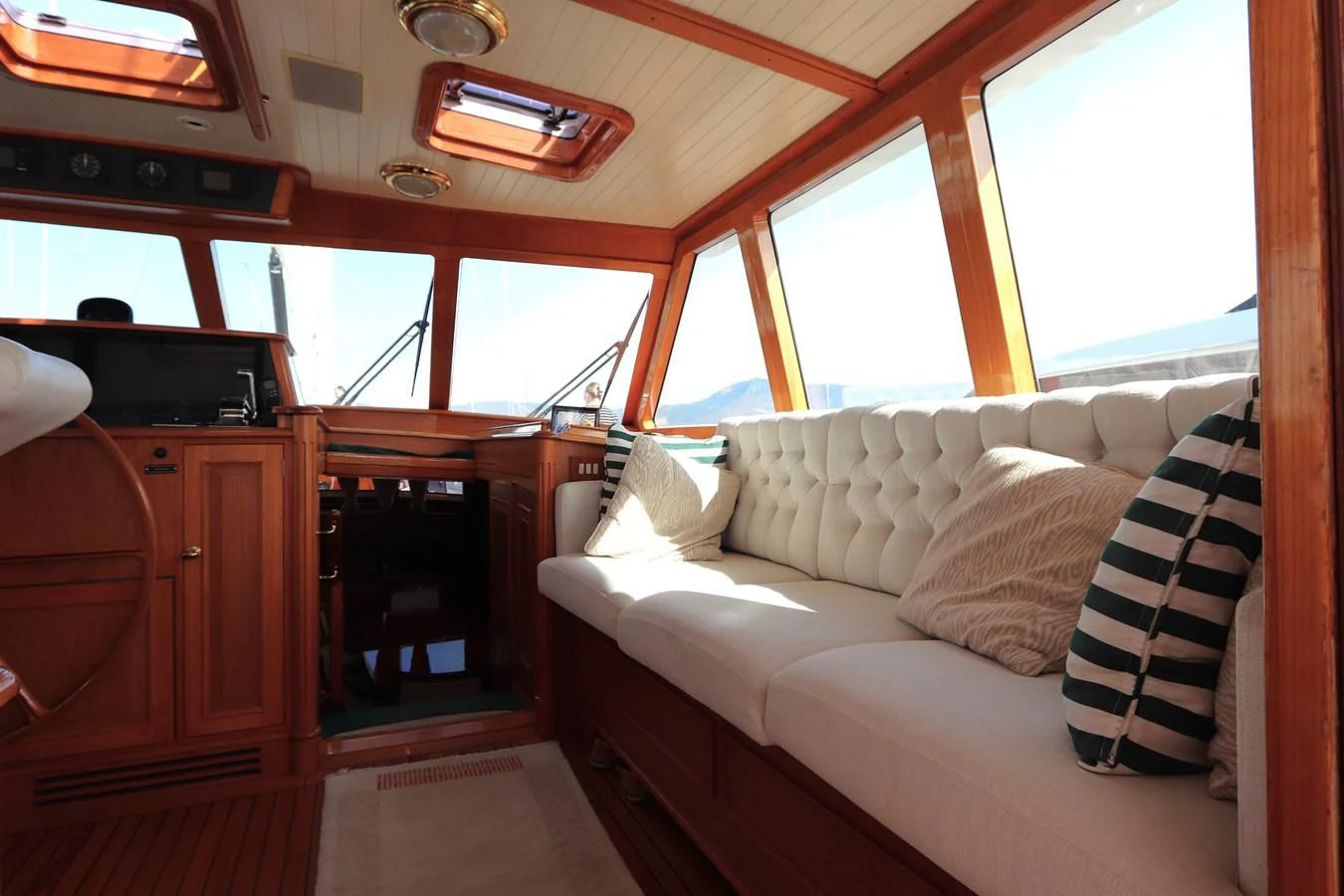 a boat with a couch aboard KEEWAYDIN Yacht for Sale