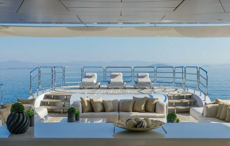 a living room with a couch and a pool aboard LADY VERA Yacht for Sale
