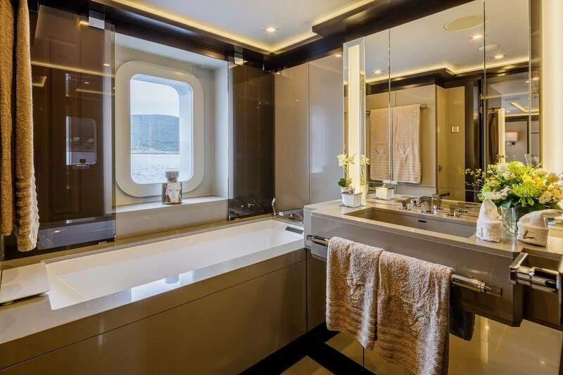 a bathroom with a large mirror aboard LADY VERA Yacht for Sale
