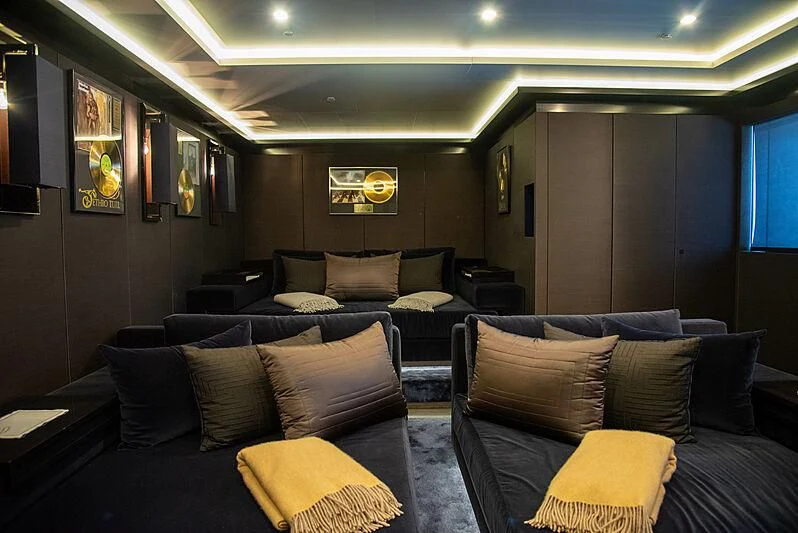 a living room with a couch and a television aboard LADY VERA Yacht for Sale