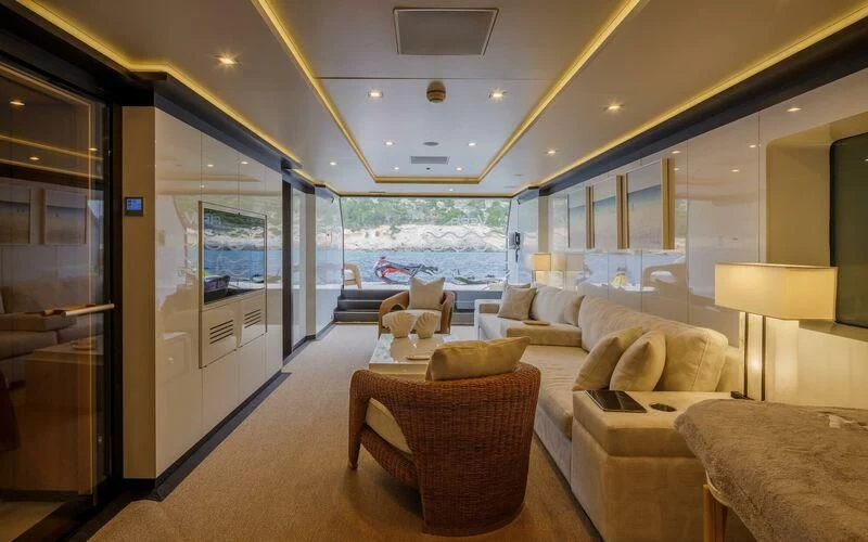 a living room with a large glass door aboard LADY VERA Yacht for Sale