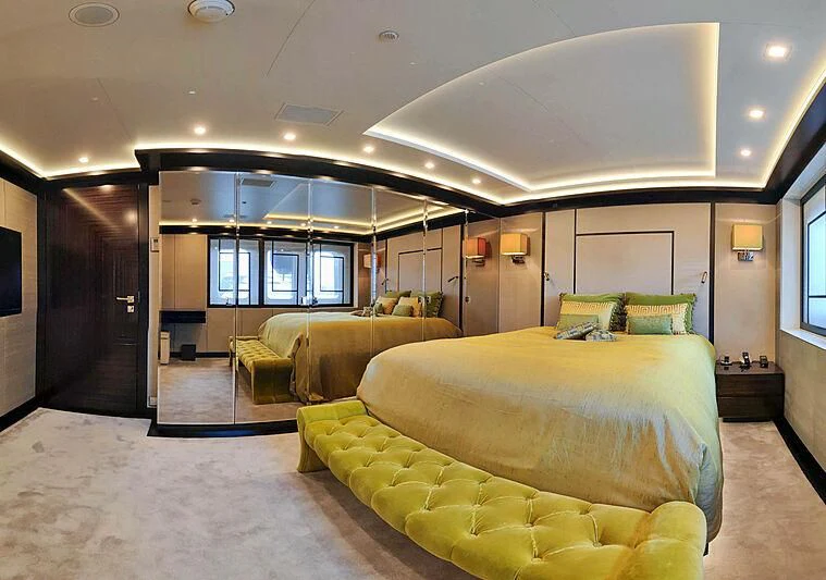 a room with a bed and a couch aboard LADY VERA Yacht for Sale