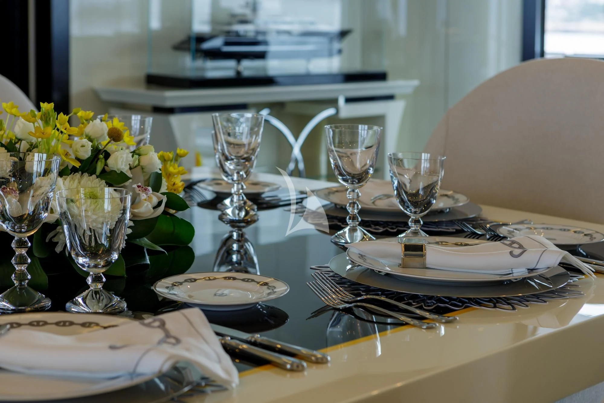 a table with plates and glasses aboard LADY VERA Yacht for Sale