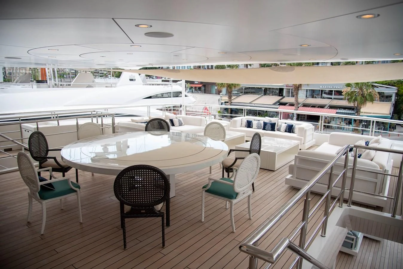 a room with tables and chairs aboard LADY VERA Yacht for Sale