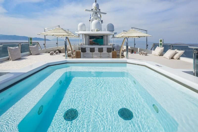 a large pool with a satellite dish on top aboard LADY VERA Yacht for Sale