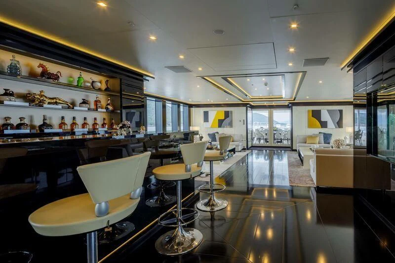 a large kitchen with a bar aboard LADY VERA Yacht for Sale